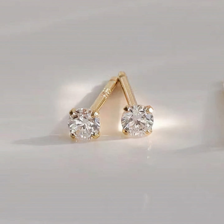 Pendientes pequeños de tapón dorados Zeke