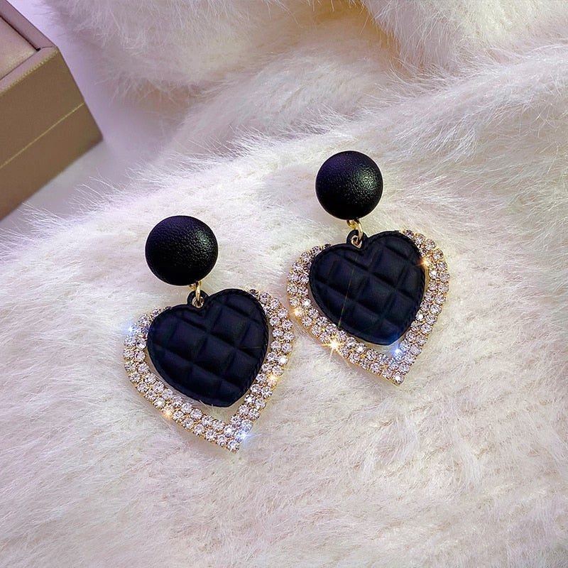 Pendientes de corazón negro en oro