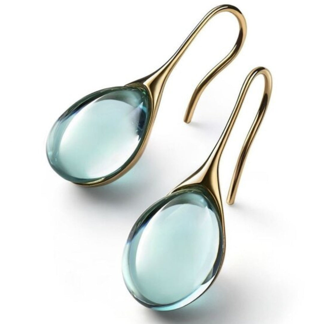 Pendientes de gota de cristal en oro y plata