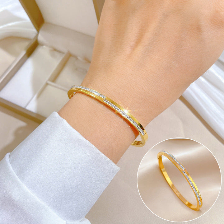 Pulsera rígida de cristal dorado Aera