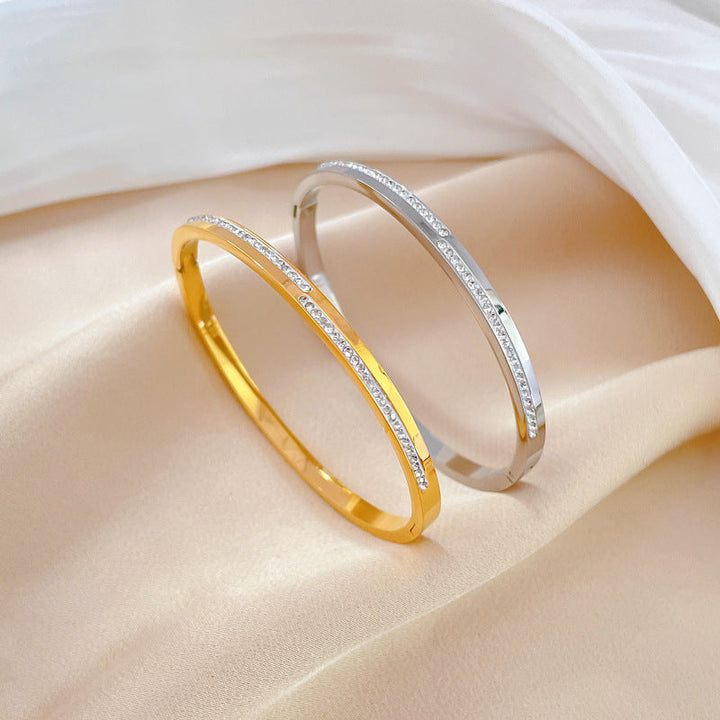 Pulsera rígida de cristal dorado Aera