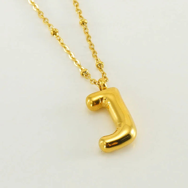 Collar especial de luz dorado de 18 quilates con esfera especial y letra inicial