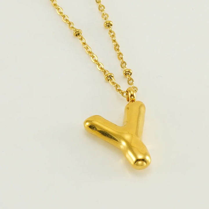 Collar especial de luz dorado de 18 quilates con esfera especial y letra inicial