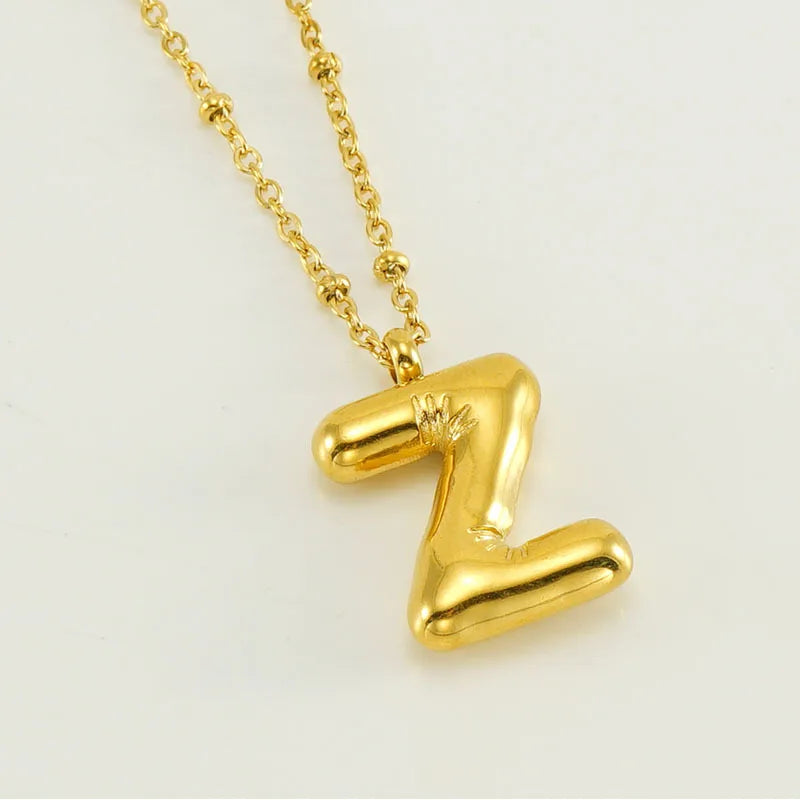 Collar especial de luz dorado de 18 quilates con esfera especial y letra inicial