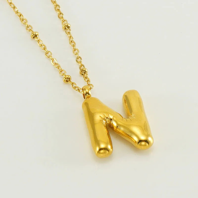 Collar especial de luz dorado de 18 quilates con esfera especial y letra inicial