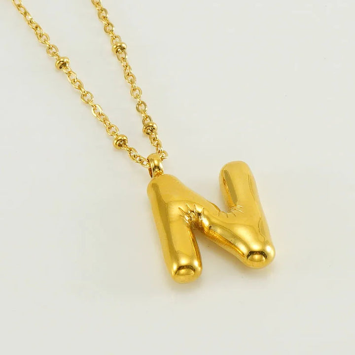 Collar especial de luz dorado de 18 quilates con esfera especial y letra inicial