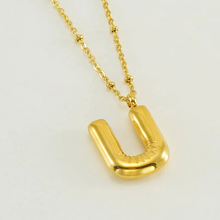 Collar especial de luz dorado de 18 quilates con esfera especial y letra inicial