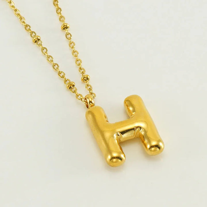 Collar especial de luz dorado de 18 quilates con esfera especial y letra inicial