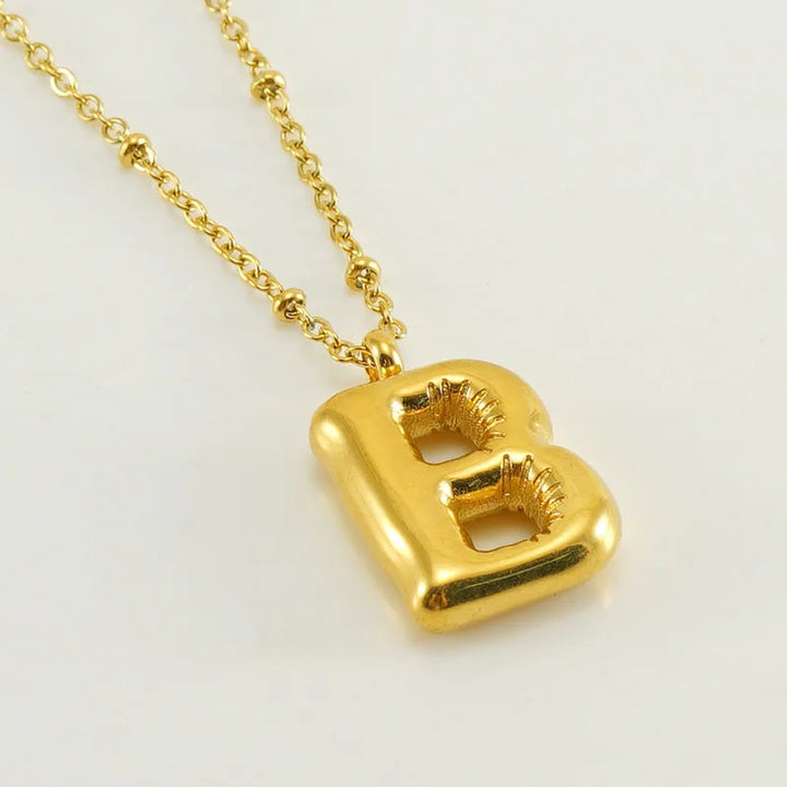 Collar especial de luz dorado de 18 quilates con esfera especial y letra inicial