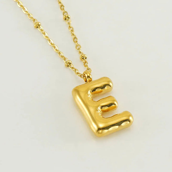 Collar especial de luz dorado de 18 quilates con esfera especial y letra inicial