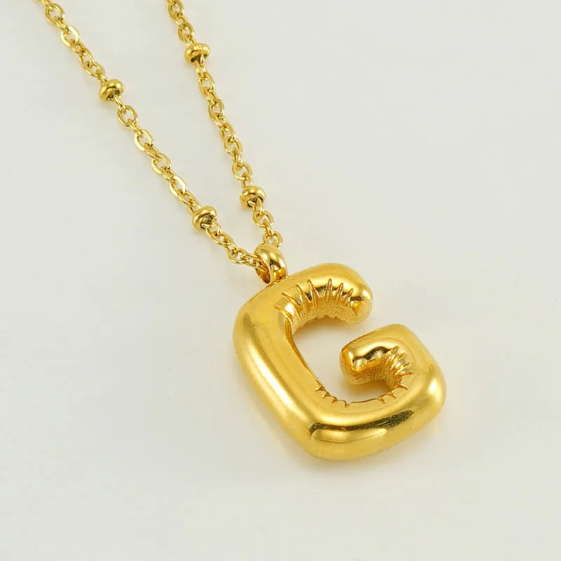 Collar especial de luz dorado de 18 quilates con esfera especial y letra inicial