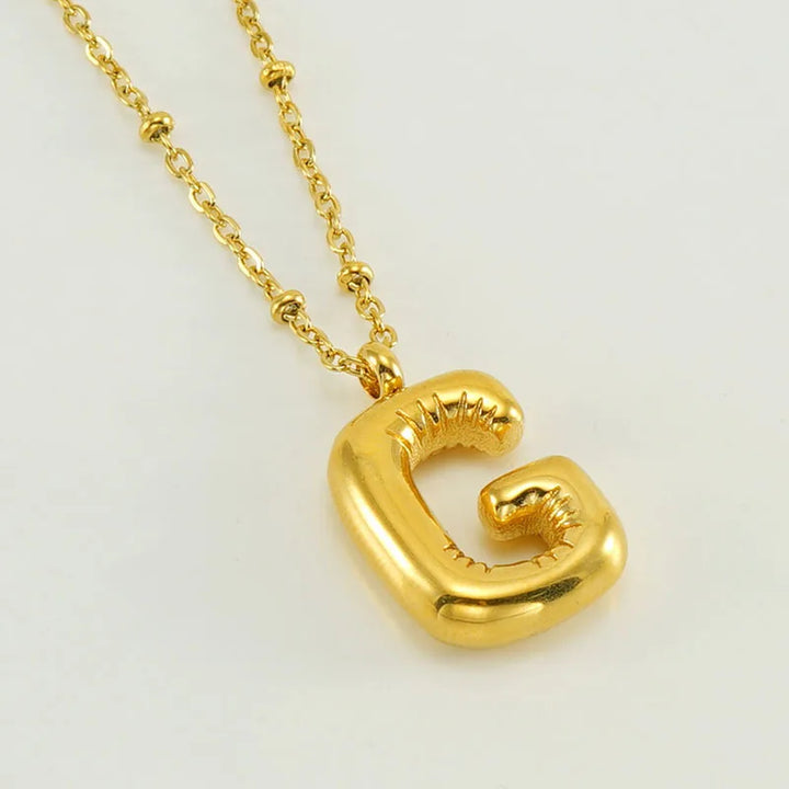 Collar especial de luz dorado de 18 quilates con esfera especial y letra inicial