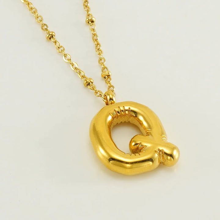 Collar especial de luz dorado de 18 quilates con esfera especial y letra inicial