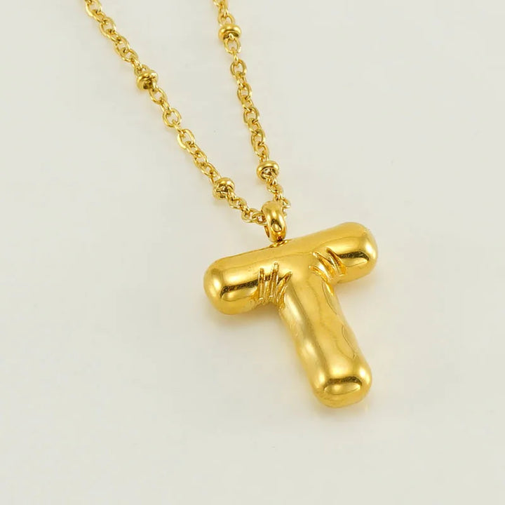 Collar especial de luz dorado de 18 quilates con esfera especial y letra inicial