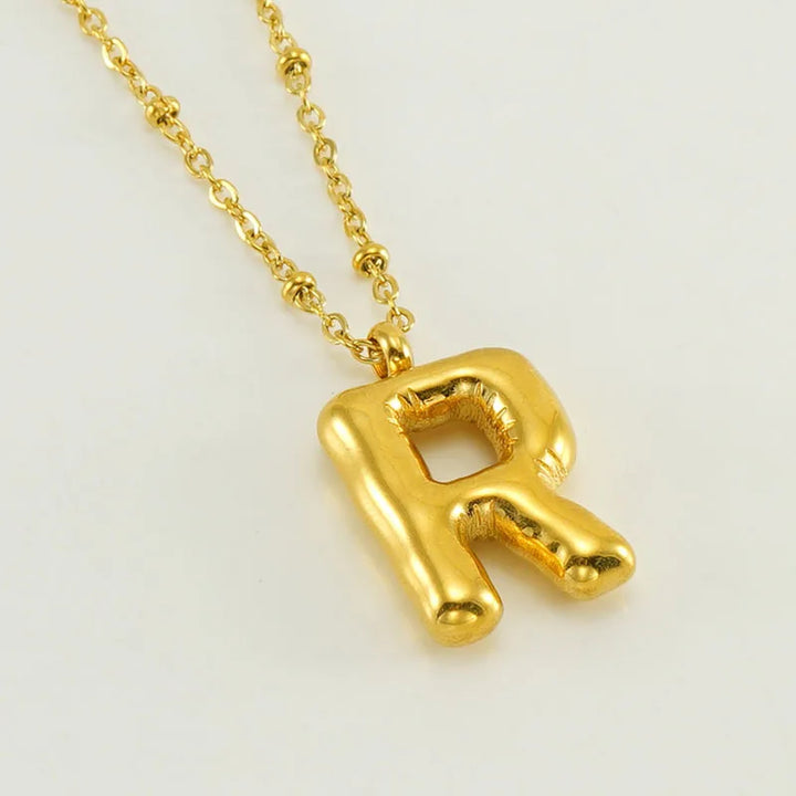Collar especial de luz dorado de 18 quilates con esfera especial y letra inicial