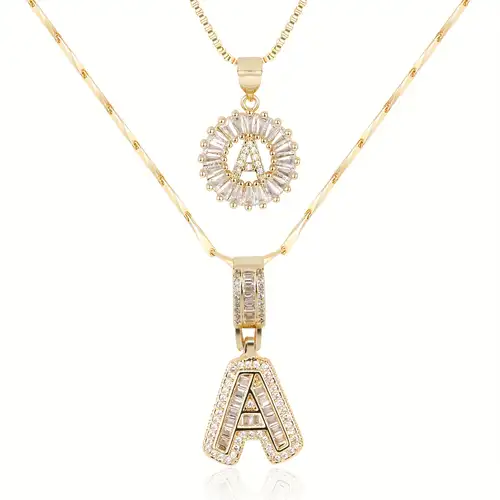 Set de collares con iniciales pavé | Oro blanco