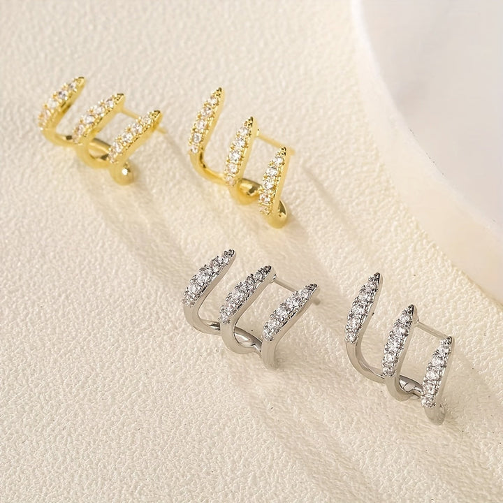 Pendientes de botón elegantes de strass con tres garras